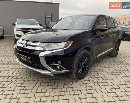 Черный Мицубиси Аутлендер, объемом двигателя 2.36 л и пробегом 143 тыс. км за 12900 $, фото 2 на Automoto.ua