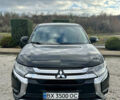 Черный Мицубиси Аутлендер, объемом двигателя 2.36 л и пробегом 119 тыс. км за 15600 $, фото 1 на Automoto.ua