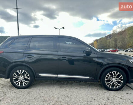 Черный Мицубиси Аутлендер, объемом двигателя 2.36 л и пробегом 119 тыс. км за 15600 $, фото 2 на Automoto.ua