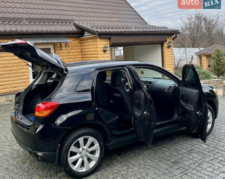 Чорний Міцубісі Аутлендер, об'ємом двигуна 2 л та пробігом 170 тис. км за 10999 $, фото 17 на Automoto.ua