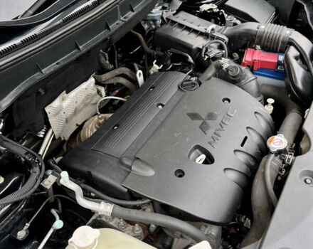 Чорний Міцубісі Аутлендер, об'ємом двигуна 2 л та пробігом 170 тис. км за 10999 $, фото 37 на Automoto.ua