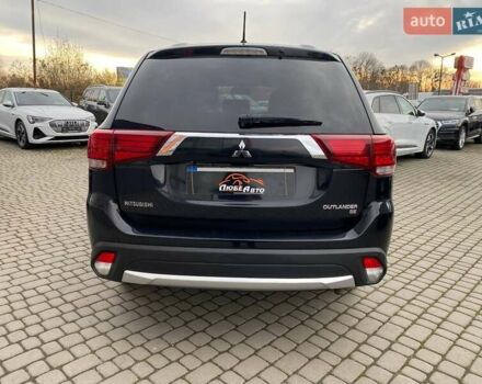 Черный Мицубиси Аутлендер, объемом двигателя 2.36 л и пробегом 143 тыс. км за 12900 $, фото 5 на Automoto.ua