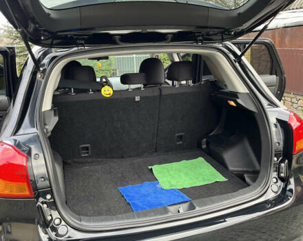 Чорний Міцубісі Аутлендер, об'ємом двигуна 2 л та пробігом 170 тис. км за 10999 $, фото 32 на Automoto.ua