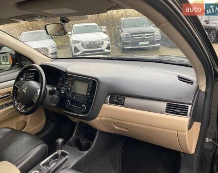 Черный Мицубиси Аутлендер, объемом двигателя 2.36 л и пробегом 143 тыс. км за 12900 $, фото 8 на Automoto.ua