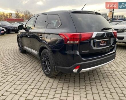 Черный Мицубиси Аутлендер, объемом двигателя 2.36 л и пробегом 143 тыс. км за 12900 $, фото 4 на Automoto.ua