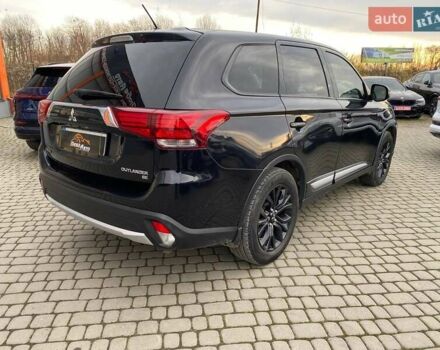 Черный Мицубиси Аутлендер, объемом двигателя 2.36 л и пробегом 143 тыс. км за 12900 $, фото 6 на Automoto.ua