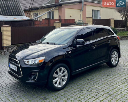 Чорний Міцубісі Аутлендер, об'ємом двигуна 2 л та пробігом 170 тис. км за 10999 $, фото 5 на Automoto.ua