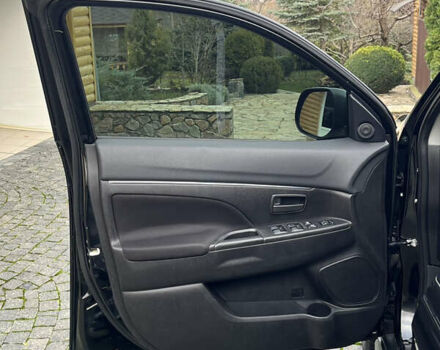 Чорний Міцубісі Аутлендер, об'ємом двигуна 2 л та пробігом 170 тис. км за 10999 $, фото 23 на Automoto.ua