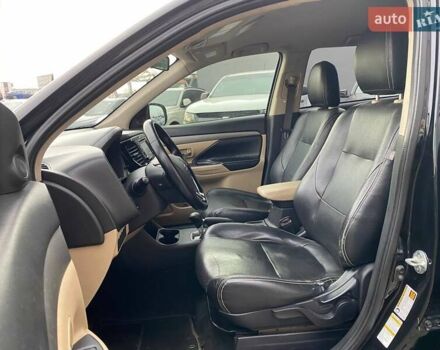 Черный Мицубиси Аутлендер, объемом двигателя 2.36 л и пробегом 143 тыс. км за 12900 $, фото 17 на Automoto.ua