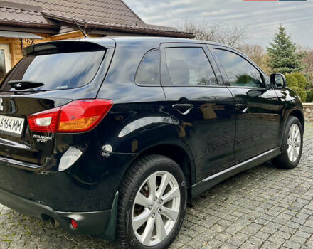 Чорний Міцубісі Аутлендер, об'ємом двигуна 2 л та пробігом 170 тис. км за 10999 $, фото 11 на Automoto.ua