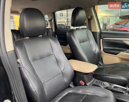 Черный Мицубиси Аутлендер, объемом двигателя 2.36 л и пробегом 143 тыс. км за 12900 $, фото 24 на Automoto.ua