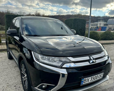 Черный Мицубиси Аутлендер, объемом двигателя 2.36 л и пробегом 119 тыс. км за 15600 $, фото 1 на Automoto.ua