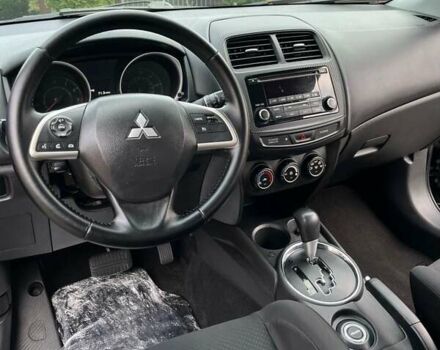 Чорний Міцубісі Аутлендер, об'ємом двигуна 2 л та пробігом 170 тис. км за 10999 $, фото 21 на Automoto.ua