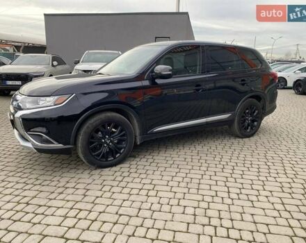 Черный Мицубиси Аутлендер, объемом двигателя 2.36 л и пробегом 143 тыс. км за 12900 $, фото 3 на Automoto.ua