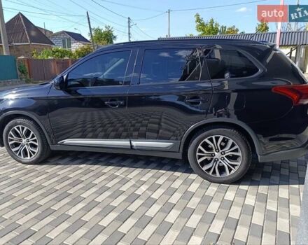 Черный Мицубиси Аутлендер, объемом двигателя 2.36 л и пробегом 120 тыс. км за 16900 $, фото 1 на Automoto.ua