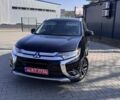 Черный Мицубиси Аутлендер, объемом двигателя 2.4 л и пробегом 120 тыс. км за 15500 $, фото 1 на Automoto.ua
