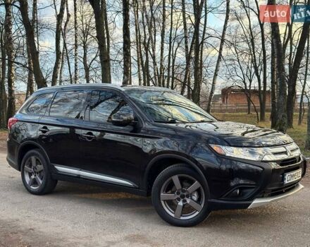 Черный Мицубиси Аутлендер, объемом двигателя 3 л и пробегом 99 тыс. км за 15800 $, фото 1 на Automoto.ua
