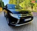 Черный Мицубиси Аутлендер, объемом двигателя 2.36 л и пробегом 130 тыс. км за 13500 $, фото 1 на Automoto.ua