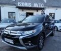 Черный Мицубиси Аутлендер, объемом двигателя 2.36 л и пробегом 320 тыс. км за 15999 $, фото 1 на Automoto.ua