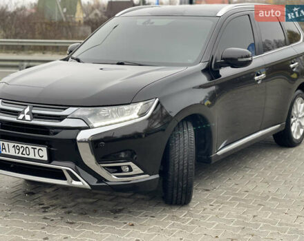 Чорний Міцубісі Аутлендер, об'ємом двигуна 2 л та пробігом 145 тис. км за 21200 $, фото 1 на Automoto.ua