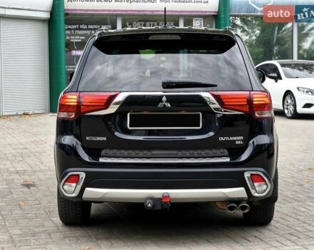 Черный Мицубиси Аутлендер, объемом двигателя 2.36 л и пробегом 162 тыс. км за 14450 $, фото 5 на Automoto.ua
