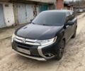 Черный Мицубиси Аутлендер, объемом двигателя 2.4 л и пробегом 185 тыс. км за 14300 $, фото 1 на Automoto.ua