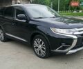 Черный Мицубиси Аутлендер, объемом двигателя 2.4 л и пробегом 109 тыс. км за 19999 $, фото 1 на Automoto.ua
