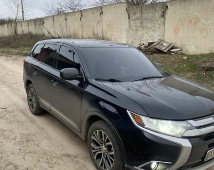 Черный Мицубиси Аутлендер, объемом двигателя 2.4 л и пробегом 185 тыс. км за 14300 $, фото 1 на Automoto.ua