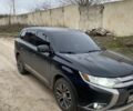 Черный Мицубиси Аутлендер, объемом двигателя 2.4 л и пробегом 185 тыс. км за 14300 $, фото 1 на Automoto.ua