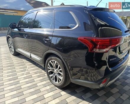 Черный Мицубиси Аутлендер, объемом двигателя 2.36 л и пробегом 120 тыс. км за 16900 $, фото 3 на Automoto.ua