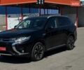 Черный Мицубиси Аутлендер, объемом двигателя 2 л и пробегом 160 тыс. км за 16500 $, фото 1 на Automoto.ua