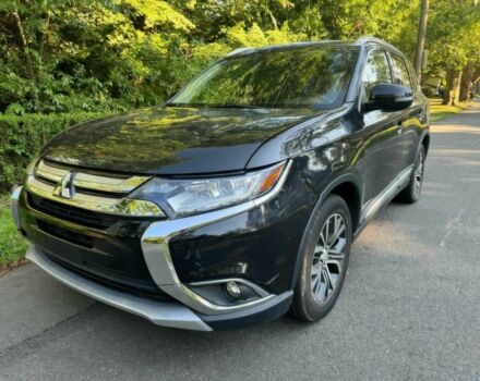 Черный Мицубиси Аутлендер, объемом двигателя 2.4 л и пробегом 66 тыс. км за 10650 $, фото 2 на Automoto.ua