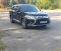 Черный Мицубиси Аутлендер, объемом двигателя 2.4 л и пробегом 156 тыс. км за 330 $, фото 1 на Automoto.ua