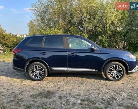 Черный Мицубиси Аутлендер, объемом двигателя 2.4 л и пробегом 221 тыс. км за 11900 $, фото 1 на Automoto.ua