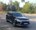 Черный Мицубиси Аутлендер, объемом двигателя 2.4 л и пробегом 156 тыс. км за 330 $, фото 2 на Automoto.ua
