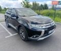 Черный Мицубиси Аутлендер, объемом двигателя 2.36 л и пробегом 98 тыс. км за 15600 $, фото 1 на Automoto.ua