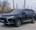 Черный Мицубиси Аутлендер, объемом двигателя 2.4 л и пробегом 197 тыс. км за 14499 $, фото 1 на Automoto.ua