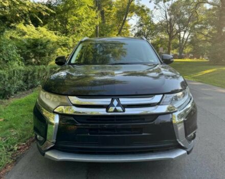 Черный Мицубиси Аутлендер, объемом двигателя 2.4 л и пробегом 66 тыс. км за 10650 $, фото 1 на Automoto.ua