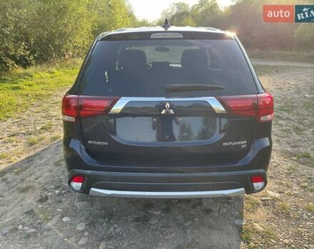Черный Мицубиси Аутлендер, объемом двигателя 2.4 л и пробегом 221 тыс. км за 11900 $, фото 4 на Automoto.ua