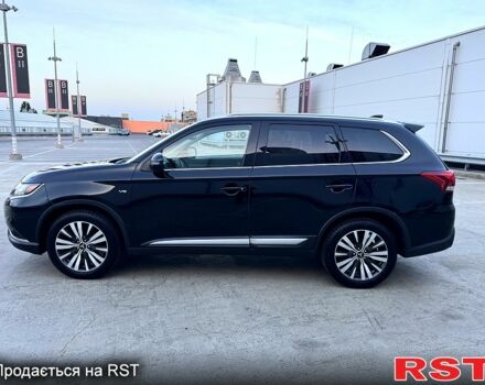 Черный Мицубиси Аутлендер, объемом двигателя 3 л и пробегом 115 тыс. км за 18200 $, фото 1 на Automoto.ua