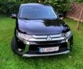 Черный Мицубиси Аутлендер, объемом двигателя 2.4 л и пробегом 120 тыс. км за 15500 $, фото 1 на Automoto.ua