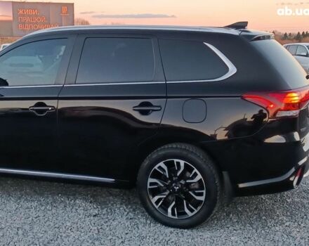 Черный Мицубиси Аутлендер, объемом двигателя 2 л и пробегом 115 тыс. км за 23700 $, фото 4 на Automoto.ua