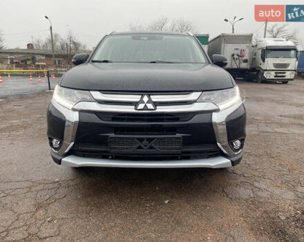 Черный Мицубиси Аутлендер, объемом двигателя 2 л и пробегом 76 тыс. км за 20800 $, фото 1 на Automoto.ua