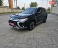 Черный Мицубиси Аутлендер, объемом двигателя 2 л и пробегом 241 тыс. км за 16999 $, фото 1 на Automoto.ua