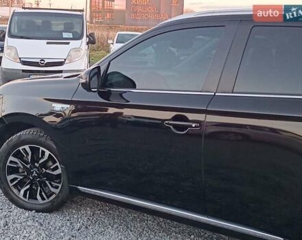 Чорний Міцубісі Аутлендер, об'ємом двигуна 2 л та пробігом 115 тис. км за 23700 $, фото 3 на Automoto.ua