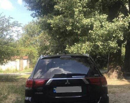 Черный Мицубиси Аутлендер, объемом двигателя 2.4 л и пробегом 125 тыс. км за 11200 $, фото 3 на Automoto.ua