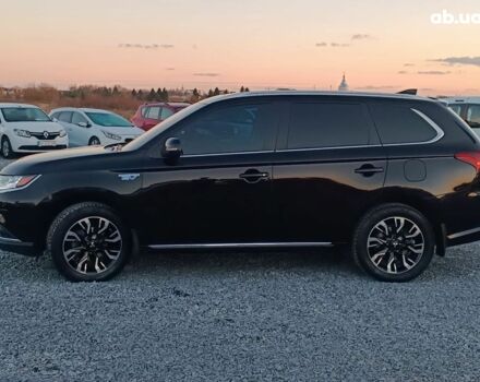 Черный Мицубиси Аутлендер, объемом двигателя 2 л и пробегом 115 тыс. км за 23700 $, фото 2 на Automoto.ua