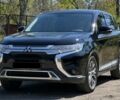 Черный Мицубиси Аутлендер, объемом двигателя 2 л и пробегом 150 тыс. км за 15500 $, фото 1 на Automoto.ua