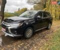 Чорний Міцубісі Аутлендер, об'ємом двигуна 2 л та пробігом 75 тис. км за 22100 $, фото 1 на Automoto.ua