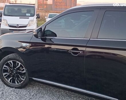 Черный Мицубиси Аутлендер, объемом двигателя 2 л и пробегом 115 тыс. км за 23700 $, фото 3 на Automoto.ua